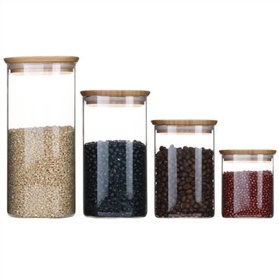 Recipient hermètic d'emmagatzematge de vidre amb tapa de bambú Joc de 4, contenidor transparent d'emmagatzematge d'aliments Pot d'emmagatzematge de rebost de cuina per a farina, cereals, sucre, te, grans de cafè, aperitius, quadrat